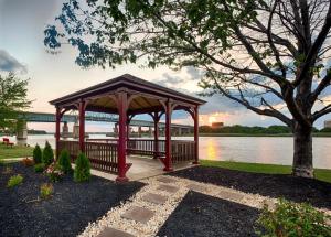 a gazebo in a park next to a lake at Red Roof Inn PLUS+ Secaucus - Meadowlands in Secaucus