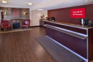 
a large room with a large counter and chairs at Red Roof Inn PLUS+ Chicago - Northbrook/Deerfield in Deerfield
