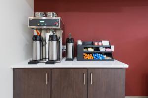 a counter with a coffee maker on top of it at Red Roof Inn Dayton - Moraine/U of Dayton in Dayton