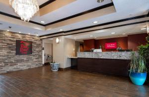a lobby of a hotel with a bar and a restaurant at Red Roof Inn & Suites Dover Downtown in Dover