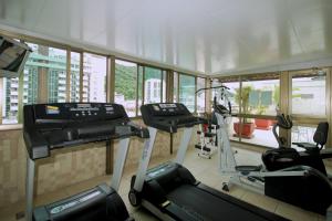 a gym with two treadmills and two exercise bikes at Mar Palace Copacabana Hotel in Rio de Janeiro