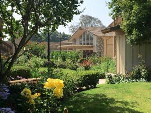 
a house with a garden in front of it at Red Roof Inn San Dimas - Fairplex in San Dimas
