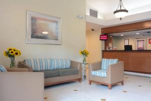a waiting room with a couch and a chair at Red Roof Inn San Dimas - Fairplex in San Dimas