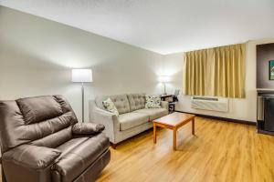 a living room with a couch and a table at Red Roof Inn Franklin, KY in Franklin