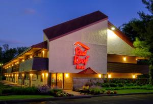 a building with a red fox sign on the side of it at Red Roof Inn Parsippany in Parsippany