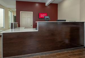a lobby with a reception desk in a building at Red Roof Inn Freehold in Freehold