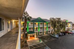 an aerial view of a hotel with a parking lot at Studio 51 Extended Stay Hotel in Phoenix +4 photos