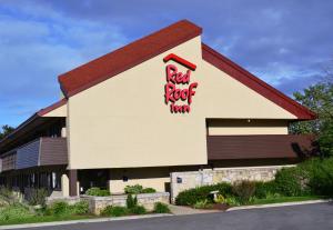 a building with a red rock inn sign on it at Red Roof Inn Merrillville in Merrillville