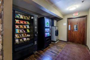 a room with a soda vending machine and a door at Red Roof Inn Osage Beach - Lake of the Ozarks in Osage Beach