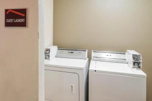 two washing machines and a washer and dryer in a room at Red Roof Inn Spartanburg - I-26 in Spartanburg