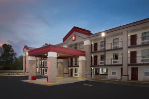 a rendering of a hotel with a gas station at Red Roof Inn PLUS+ Birmingham East – Irondale/Airport in Birmingham