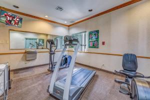 a gym with a treadmill and chairs in a room at Red Roof Inn Amarillo West in Amarillo
