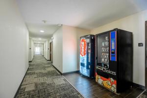 a hallway with soda vending machines in a building at Red Roof Inn Hillsville in Hillsville