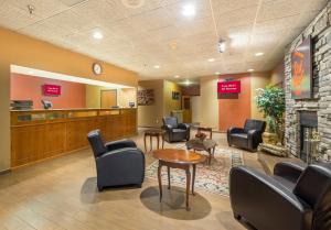 a waiting room at a hospital with chairs and a fireplace at Red Roof Inn Fulton in Fulton