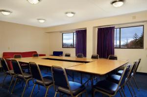 a conference room with a large table and chairs at Red Roof Inn PLUS+ Pittsburgh East - Monroeville in Monroeville