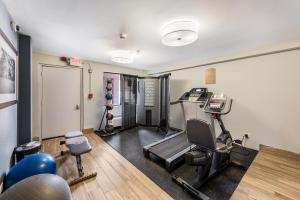 a room with a gym with a treadmill and weights at Red Roof Inn Morton Grove in Morton Grove