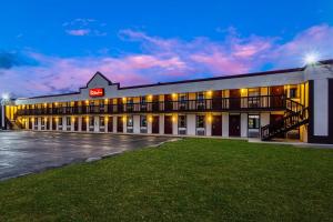 a rendering of a hotel at night at Red Roof Inn Scottsburg in Scottsburg