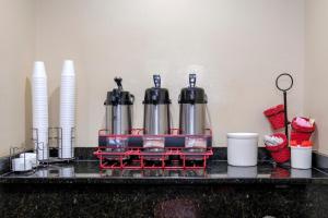 a kitchen counter with a counter top with two coffee makers at Red Roof Inn PLUS+ Palm Coast in Palm Coast