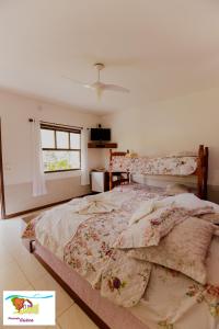 Cama ou camas em um quarto em Pousada Caúca