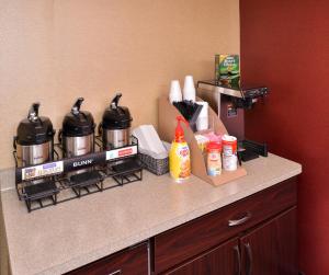 a kitchen counter with pots and pans on top of it at Red Roof Inn Milwaukee Airport in Oak Creek