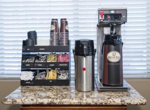 a coffee maker sitting on a counter next to a box at Red Roof Inn Chipley in Chipley