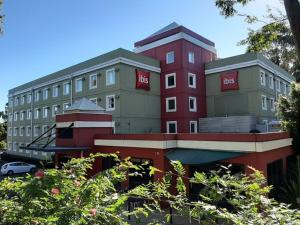 a building with the bbc on the side of it at ibis Thornleigh in Thornleigh