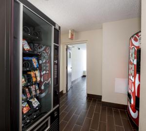 a large refrigerator filled with lots of soda at Red Roof Inn Dumfries-Quantico in Dumfries