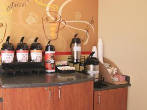 a counter with a bunch of bottles on it at Red Roof Inn Somerset, KY in Somerset