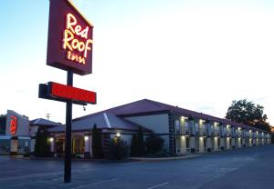 a red rock motel sign in front of a building at Red Roof Inn Somerset, KY in Somerset