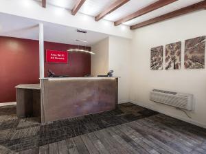 a lobby with a reception desk in a building at Red Roof Inn Lancaster Strasburg in Lancaster