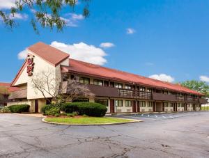 a large building with a red roof at Red Roof Inn Detroit - Plymouth/Canton in Plymouth
