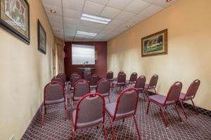 a conference room with a bunch of chairs and a screen at Red Roof Inn & Suites Macon in Macon +34 photos