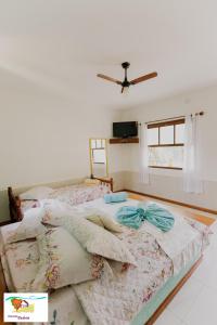 Cama ou camas em um quarto em Pousada Caúca