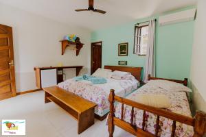 Cama ou camas em um quarto em Pousada Caúca