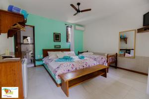Cama ou camas em um quarto em Pousada Caúca