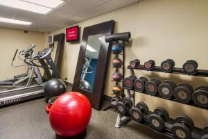 a gym with a bunch of weights and a red ball at RedRoof Inn, Meriden, CT in Meriden