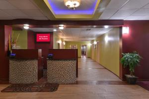 a hallway of a hospital with a lobby with airusacistacistacist at Red Roof Inn Chambersburg in Chambersburg