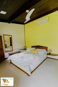 Cama ou camas em um quarto em Pousada Caúca