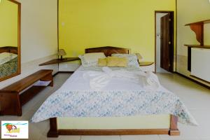 Cama ou camas em um quarto em Pousada Caúca