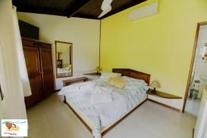 Cama ou camas em um quarto em Pousada Caúca