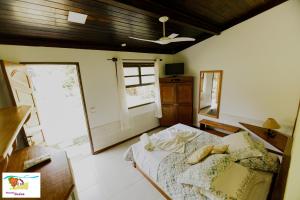 Cama ou camas em um quarto em Pousada Caúca