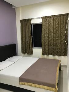 Postel nebo postele na pokoji v ubytování Hotel 3Winz, Chow Kit Hospital Kuala Lumpur