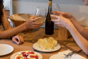 a group of people sitting at a table with wine glasses at EARTHMANS OSAKA-JO in Osaka +33 photos