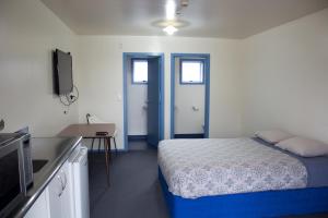 Voodi või voodid majutusasutuse The Lazy Shag Lodge toas
