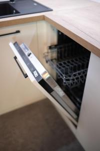 Kuchyňa alebo kuchynka v ubytovaní Apartsee Wellness Plzeň