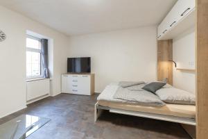 Posteľ alebo postele v izbe v ubytovaní Apartsee Wellness Plzeň