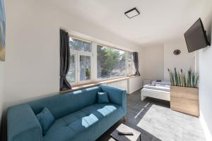 Televízia a/alebo spoločenská miestnosť v ubytovaní Apartsee Wellness Plzeň