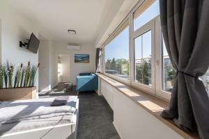 Posteľ alebo postele v izbe v ubytovaní Apartsee Wellness Plzeň