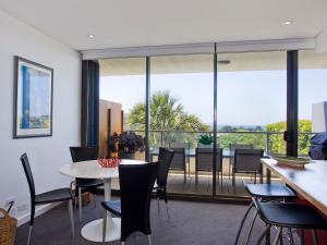 a dining room with a table and chairs at Lorne Chalet Apartment 10 in Lorne