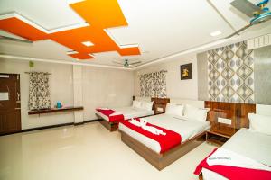 Voodi või voodid majutusasutuse Akash Residency toas